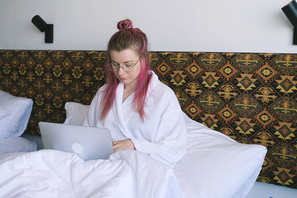 Woman working on laptop from home in a relaxed, flexible environment