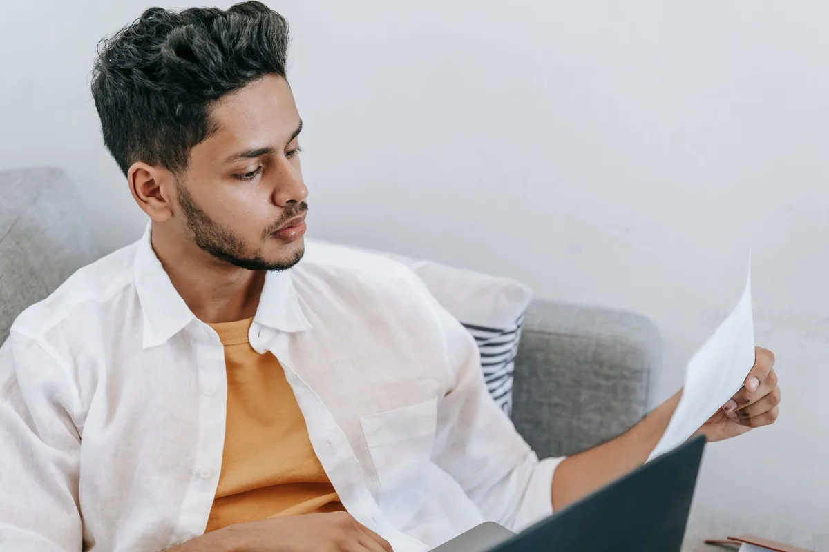 Person reviewing freelancer profiles on a laptop