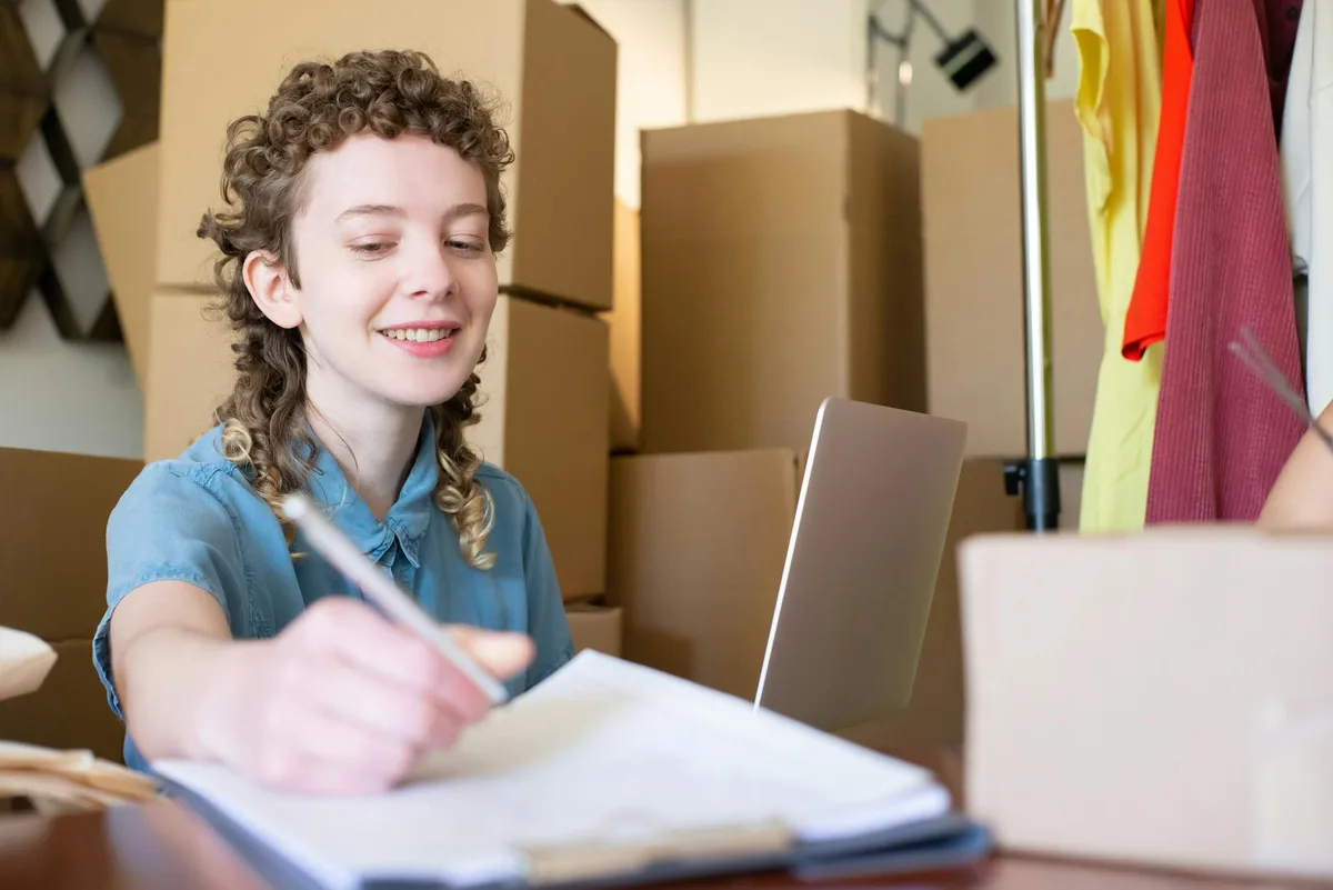 Small business owner reviewing a task list before delegating to a virtual assistant service